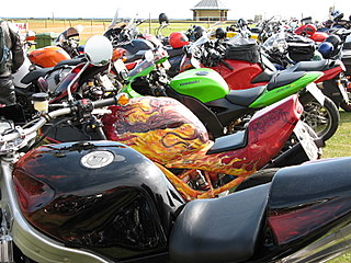 A parking lot filled to capacity with motorcycles