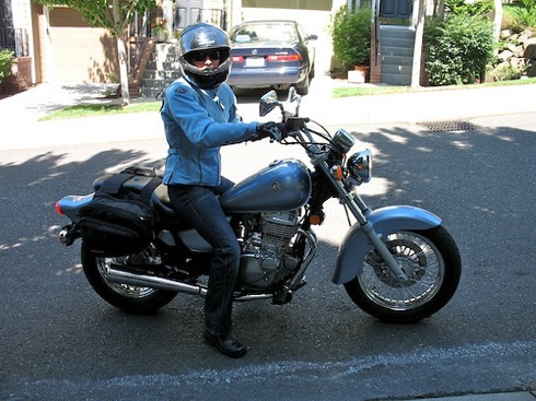 Woman On Suzuki GZ250 Motorcycle