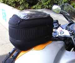 A tank bag, filled to the brim with stuff