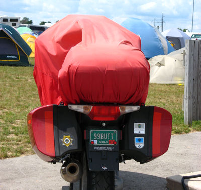 Motorcycle with bright red cover, at the BMW Rally in Wisconsin