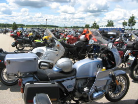 Many motorcycles parked at a motorcycle rally
