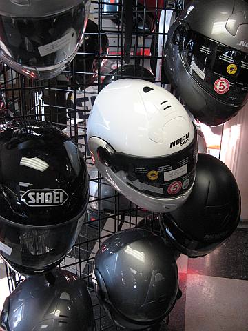 Many Motorcycle Helmets