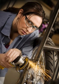 Woman Working On Motorcycle